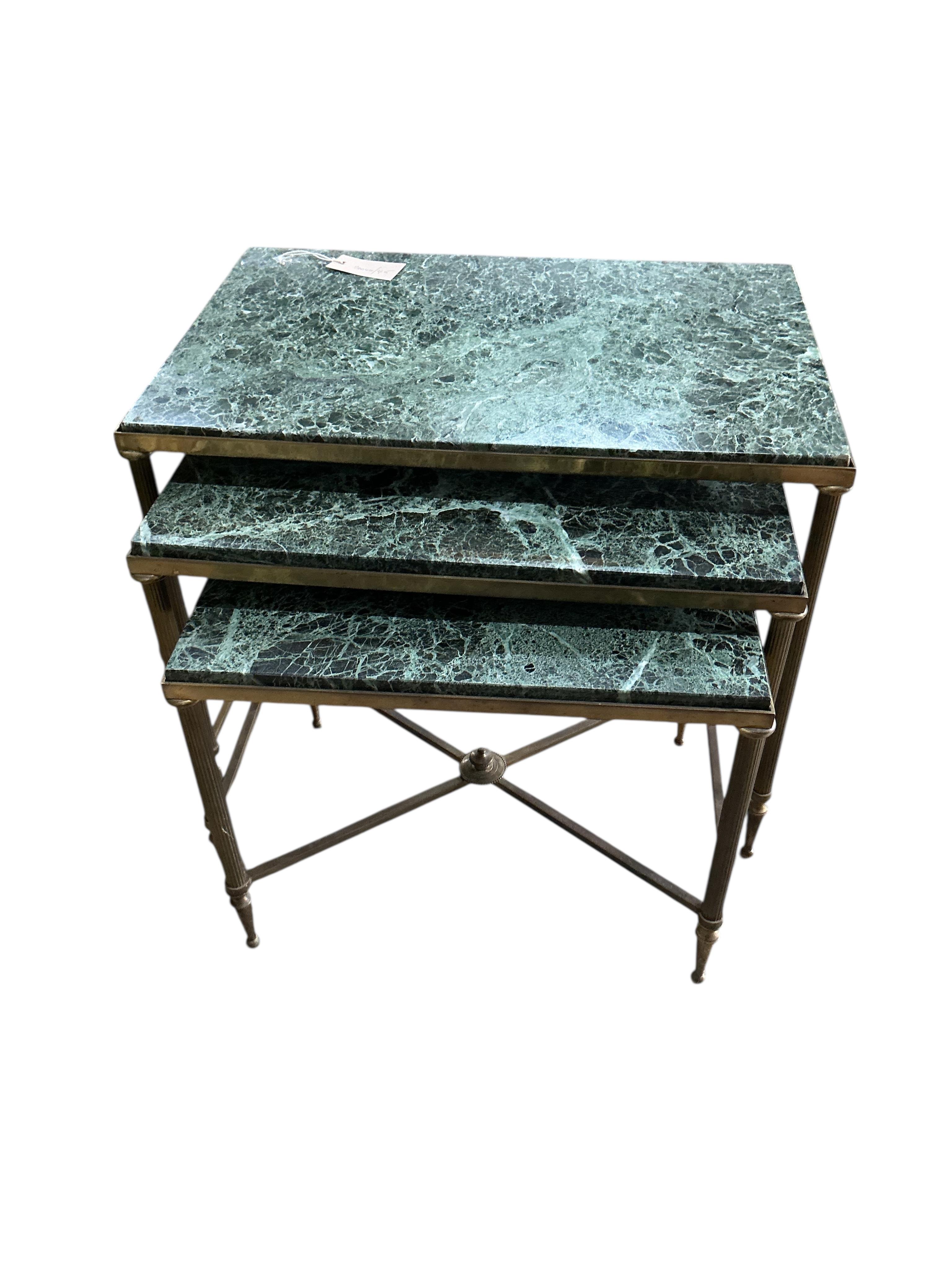 A nest of three Maison Jansen style rectangular brass and marble tables, width 55cm, depth 36cm, height 46cm